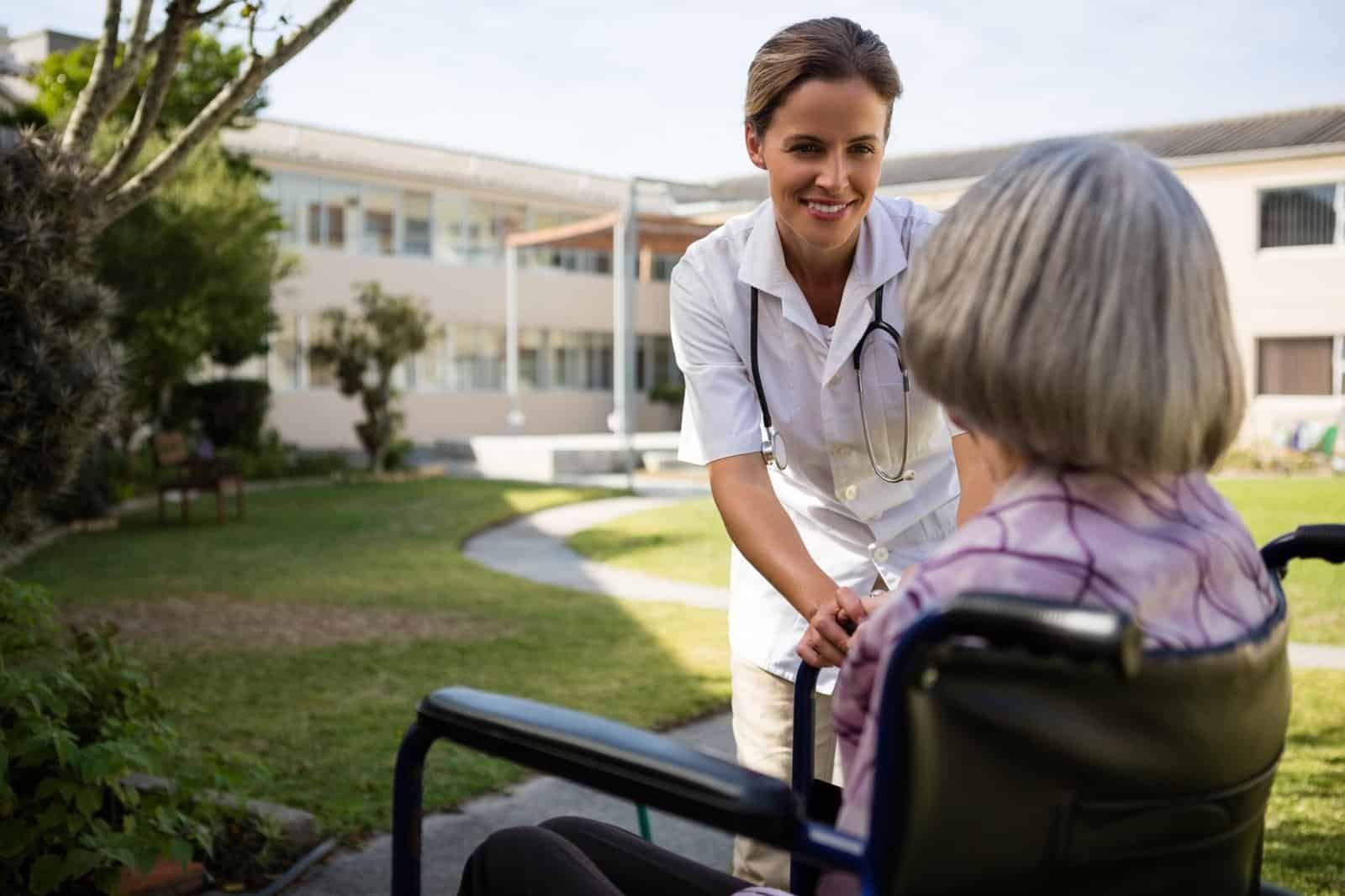 doctor-talking-to-senior-woman-sitting-on-wheelcha-2025-04-05-02-17-04-utc