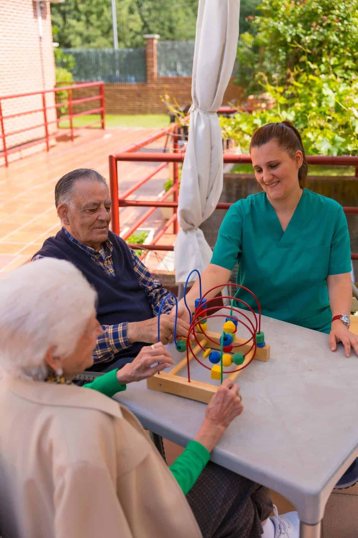 two-elderly-people-in-the-garden-of-a-nursing-home-2024-12-09-01-17-17-utc